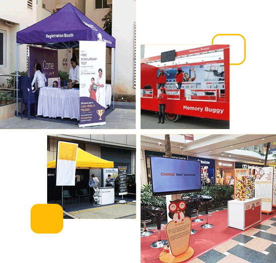 A lively event scene with people handing out pamphlets and engaging in brand activations with colorful banners