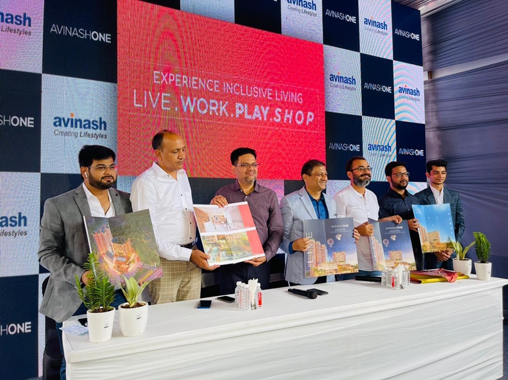 A professional event management scene with a stage, audience, and event planners coordinating